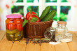 Tasty green cucumbers and red tomatoes in basket,