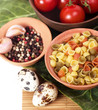 Italian raw pasta with tomatoes, quail eggs and spices
