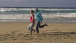 Couple jogging, race on the beach