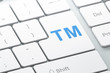 Law concept: Trademark on computer keyboard background