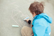 Photo: Boy drawing on road Boy drawing on road