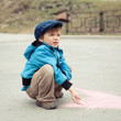 Photo: Boy drawing on road Boy drawing on road