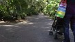 Video: young mother walking with baby in stroller young mother walking with baby in stroller