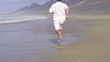 Man running on beautiful beach