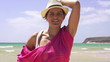 Young beautiful happy woman by the sea