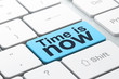 Timeline concept: Time is Now on computer keyboard background
