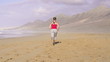 Woman jogging on beautiful beach, super slow motion, 240fps