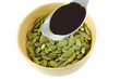 Photo: A Spoon of Pumpkin Seed Oil above Roasted Pumpkin Seeds A Spoon of Pumpkin Seed Oil above Roasted Pumpkin Seeds