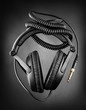 Modern headphones over dark background