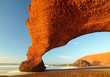 Red archs on atlantic ocean coast. Morocco