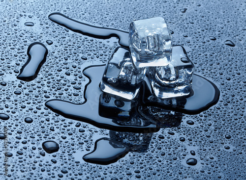 Photo: Ice cubes over dark background Ice cubes over dark background