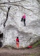 Young women climbing on limestone wall