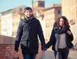 Young Couple Walking in the City with Shopping Bags