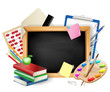 little blackboard as background with pens,pencils,books,apple