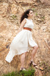 Portrait of a beautiful woman in white dress.