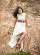 Portrait of a beautiful woman in white dress.