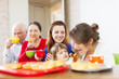  family having tea with cakes