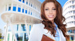 Businesswoman outside a modern office building