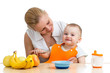 Foto: mother spoon feeding baby boy mother spoon feeding baby boy