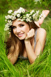 beautiful girl in wreath of flowers