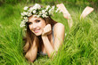 beautiful girl in wreath of flowers