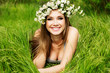 beautiful girl in wreath of flowers