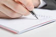Writing in a notebook