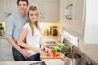 Man and woman working together in the kitchen