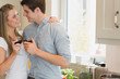 Couple looking at each other and drinking wine