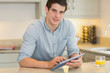 Man with tablet pc and orange juice