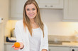 Photo: Woman with orange in her hand Woman with orange in her hand