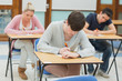 Photo: Writing students at desks in a classroom Writing students at desks in a classroom