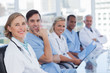Medical team sitting in row