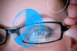 Photo: Woman wearing glasses with blue identification technology Woman wearing glasses with blue identification technology