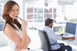 Photo: Portrait of smiling woman in creative office Portrait of smiling woman in creative office