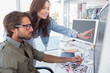 Colleague pointing photo out to editor