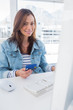 Smiling woman purchasing online with her credit card