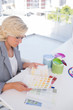 Focus interior designer looking at colour charts
