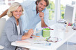 Foto: Smiling colleagues of interior design working together Smiling colleagues of interior design working together