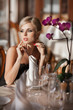 beautiful blonde woman in cafe restaurant