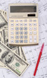 calculator with pen and dollars