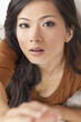Foto: Beautiful Chinese Asian Woman Reaching to Camera Beautiful Chinese Asian Woman Reaching to Camera