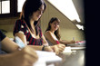 happy female student smiling at camera in college library