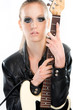 Beautiful rock girl holding a guitar