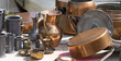 Photo: collection of tin and copper pans and pitchers at garage sale collection of tin and copper pans and pitchers at garage sale