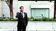 Handsome hispanic businessman talking at phone