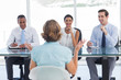 Recruitment consultants smiling in front of an applicant