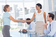 Standing recruitment consultant shaking hand of an applicant