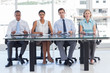 Group of business people sat in line
