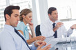Three business people during a meeting